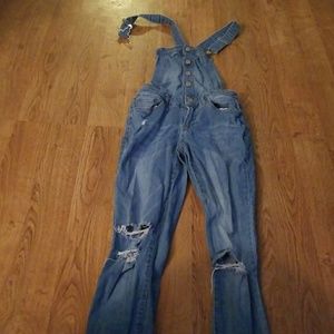 Distressed denim overalls